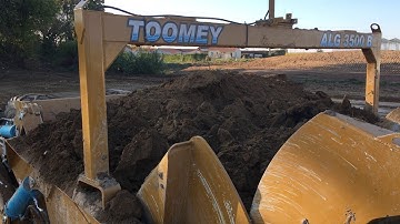 TOOMEY 3500B Scraper and Challenger stripping topsoil in France.