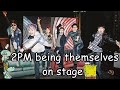 2PM being themselves on stage.