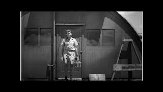 Harold Agnew carrying the plutonium core of the Nagasaki Fat Man bomb, 1945