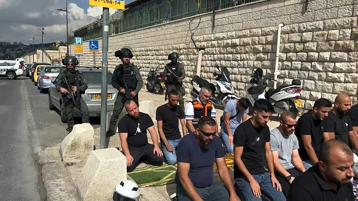 Palestinians perform Friday prayers in the street | AFP