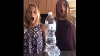 Two girls pull off best water bottle flip EVER! (real or fake?)