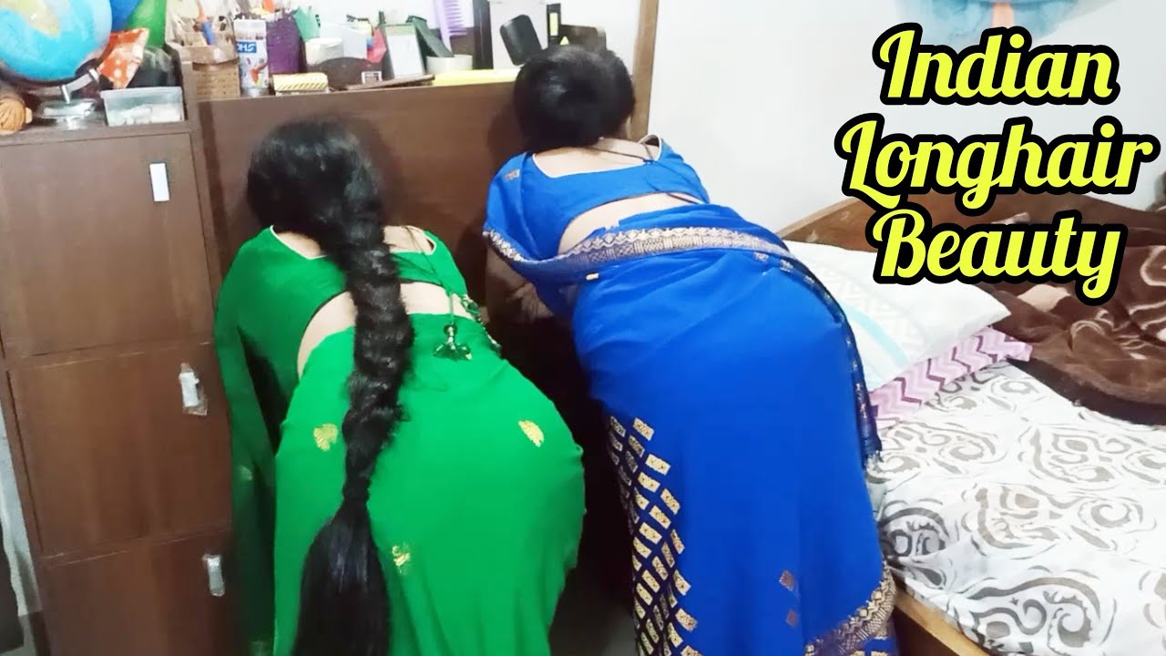 Two most beautiful long hair rapunzels in traditional dress