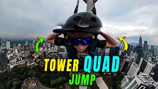 Guy Base Jumps off of a Tower While Doing a Quad Flip