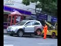 Shanghai Lady Drives Off With Tow Truck