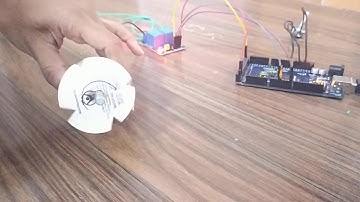 A program in arduino IDE to control DC motor direction based on potentiometer ( POT) analog input .
