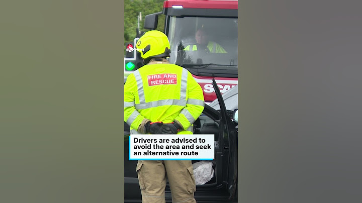 Road closed near hospital after car crashes into traffic lights
