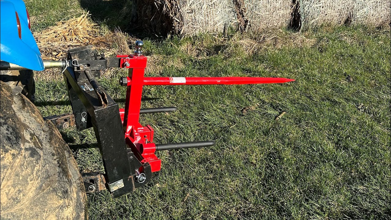 Moving hay with the Yintatech 3 pt bale spear.