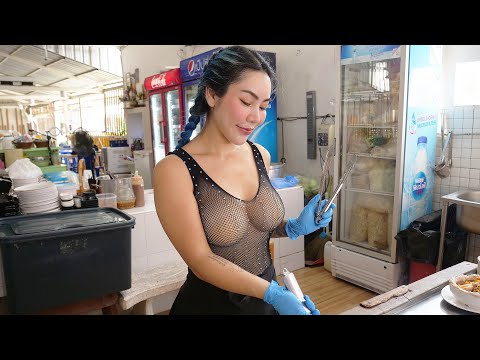 Lady chef cooking the most popular pork noodles - Thai street food