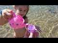 Kids playing on the beach . They making ice cream and cakes from sand. Video 2016