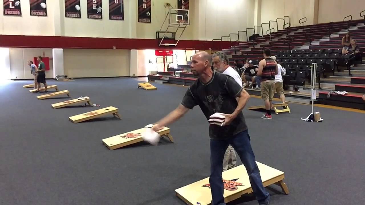 Learn to toss a cornhole bag YouTube