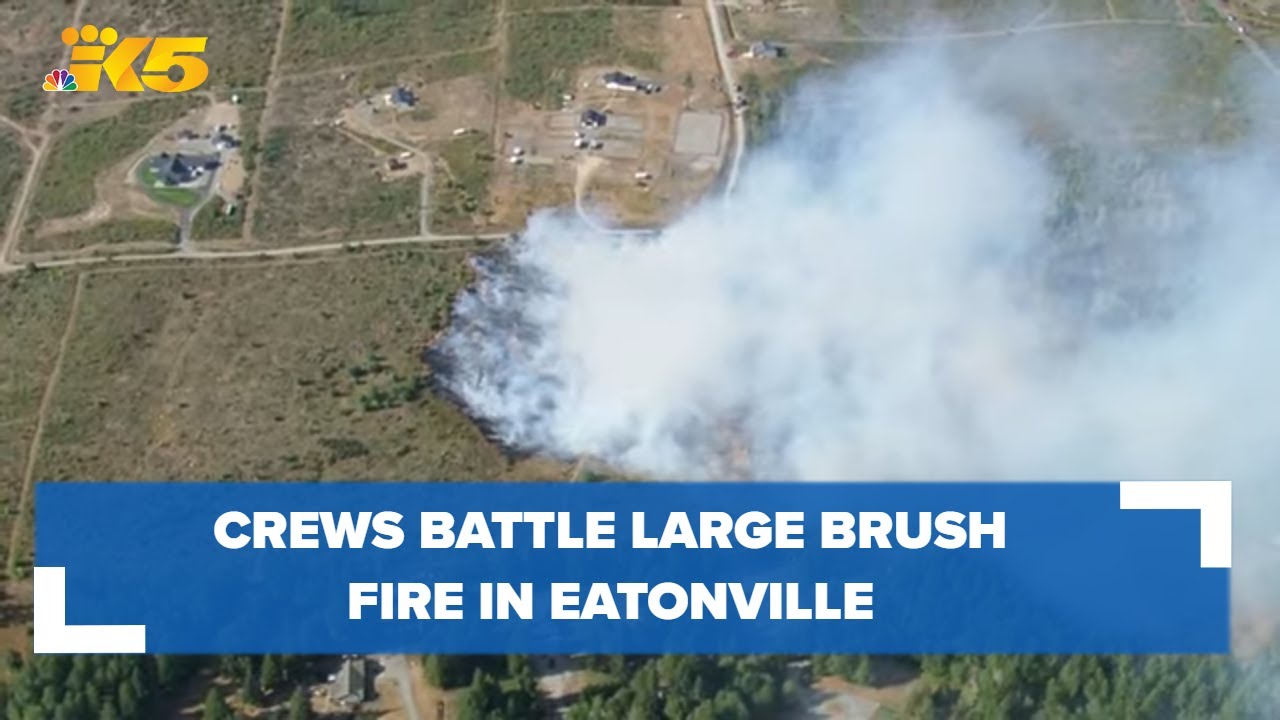 Aerials: Crews battle brush fire in Eatonville - YouTube
