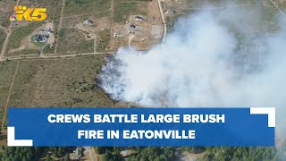Aerials: Crews battle brush fire in Eatonville