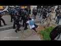 Clashes in paris on may day 2024 sees woman floored by a brick