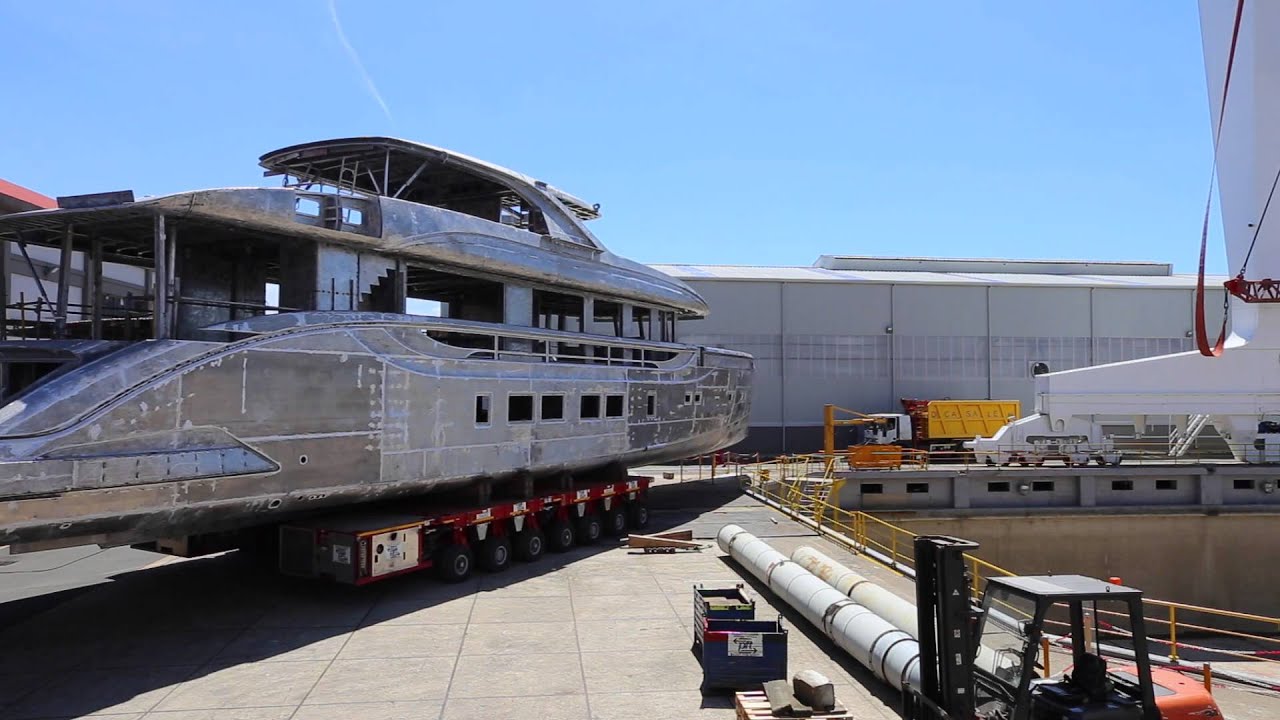 Hull and Superstructure of DYNAMIQ D4 Yacht being transported to the new shed