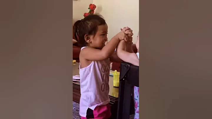 Scarlett dancing with her little sister with the s...