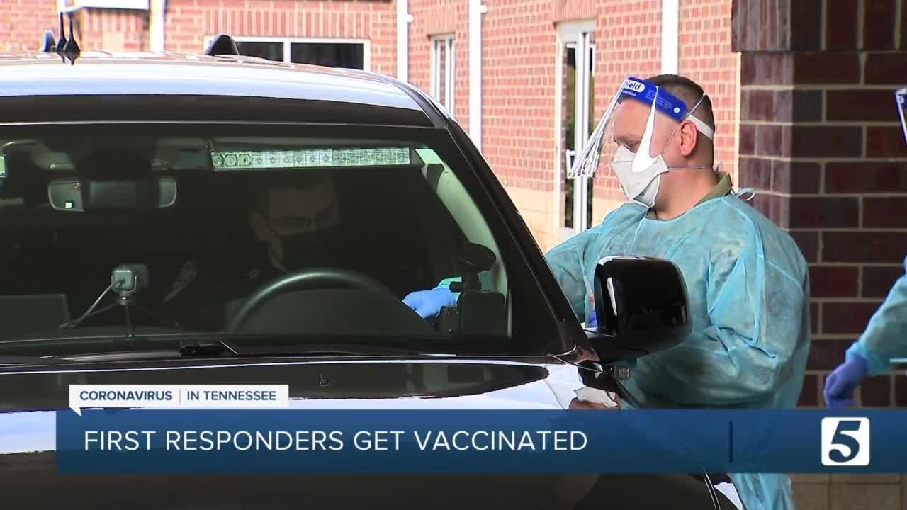 First responders get COVID-19 vaccine in drive-thru - YouTube