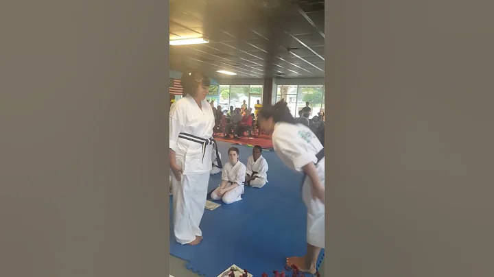 Kelly Hackney (aka Mama) recieving novice black belt