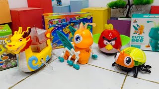 Unpack the Bee Robot, Owl Robot, Fly Robot and Dragon Boat Toys