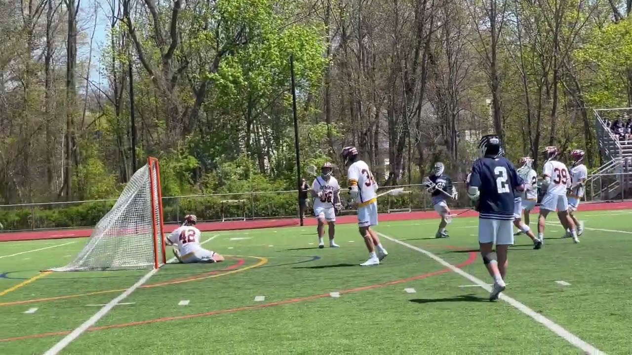 Chatham lacrosse player Ronan Curry scores vs. Summit