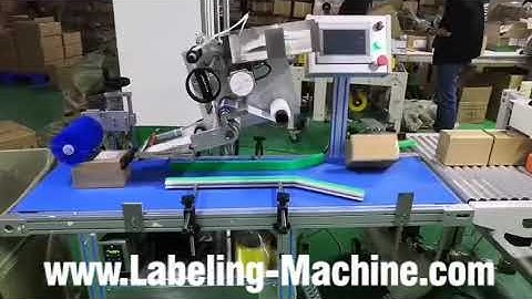 Automatic small carton box pushing down top flat surface labeling machine running video