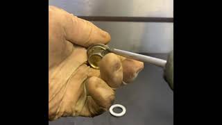 How to remove an overused drain bolt crush washer safely