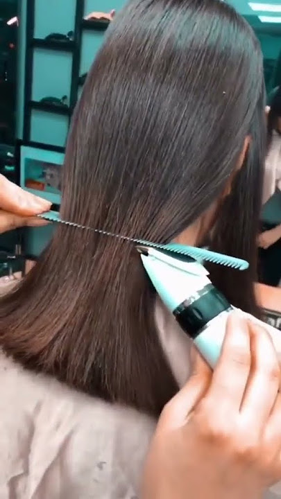 The clippers easily slide through her mass of hair #haircut #transformation #longtoshort #bobcut