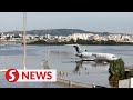 Aerial video shows submerged plane, runways flooded at Brazil airport