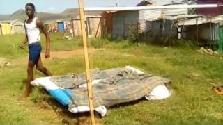 South African Boy At High Jump Training In Backyard