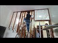 Watch young carpenter complete the staircase wall