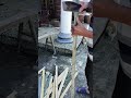 Splitting cut bamboo into strips for weaving material