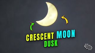 A Clear Crescent Moon Filmed by a Person
