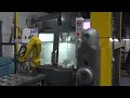 This fanuc robot on a haas vf2 has aaran 1 engineering mass producing parts