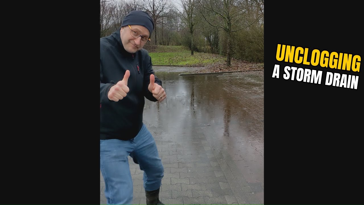 #011-2 Unclogging a storm drain after rain on a parking lot in Germany ...