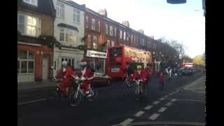 Father Christmasses on bikes with music