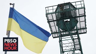 Ukrainians celebrate national unity and prepare for war as Russian threat lingers