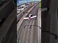 Small plane landing on a roadway