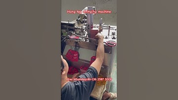 Hang tag stringing machine