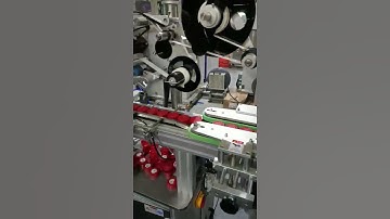 Full automatic plastic bottle cap top side labeling machine #labeling #labelingequipment #labelers