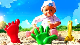 Baby dolls go to the beach! Sand games with dolls & toys. Baby doll is hungry! Dolls videos for kids