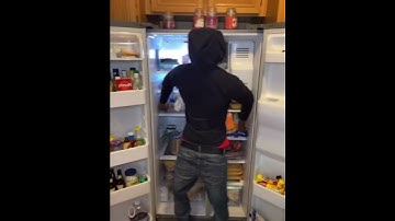 Thumbnail of Guy scares his sister with the backwards hoodie refrigerator prank.