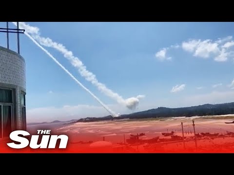 China launches LIVE FIRE drills 12 miles from Taiwan as troops 'shoot at drones'