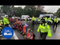 Insulate Britain protesters glue their hands to the M4 motorway