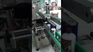 Round shape wine bottle vertical automatic rolling labeling machine running video