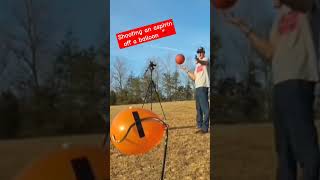 Shooting an aspirin off a balloon, left-handed, while spinning a basketball on my finger #trickshots