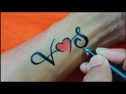 Minimalist V letter tattoo on the wrist.