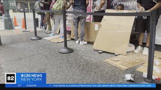 Asylum seekers prepare to camp out for 2nd night outside Roosevelt Hotel