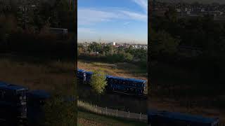 Norfolk Southern freight train approaching a vertical lift bridge