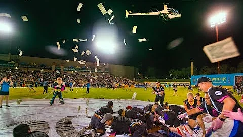 FROM ALL ANGLES: $5,000 falls from the sky at Cashman Field