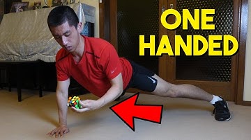 One Handed Pushups While Solving A Rubik