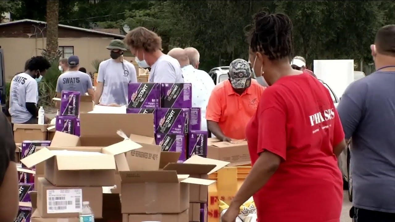 Back-to-school giveaway stocks families in need with food, supplies